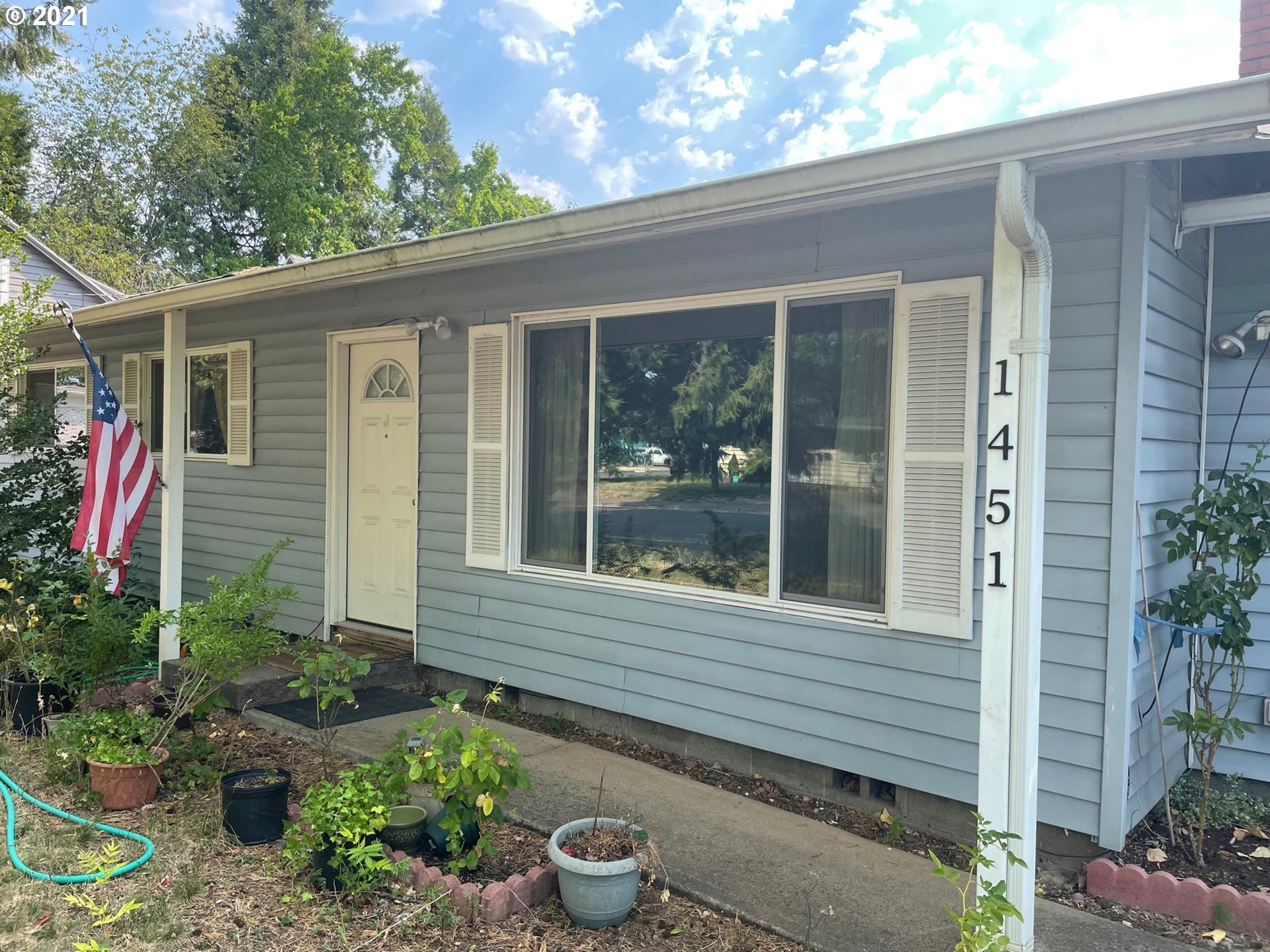 1451 Water Street Springfield, OR 97477 - Photo 1 of 23 a view of a house with a backyard