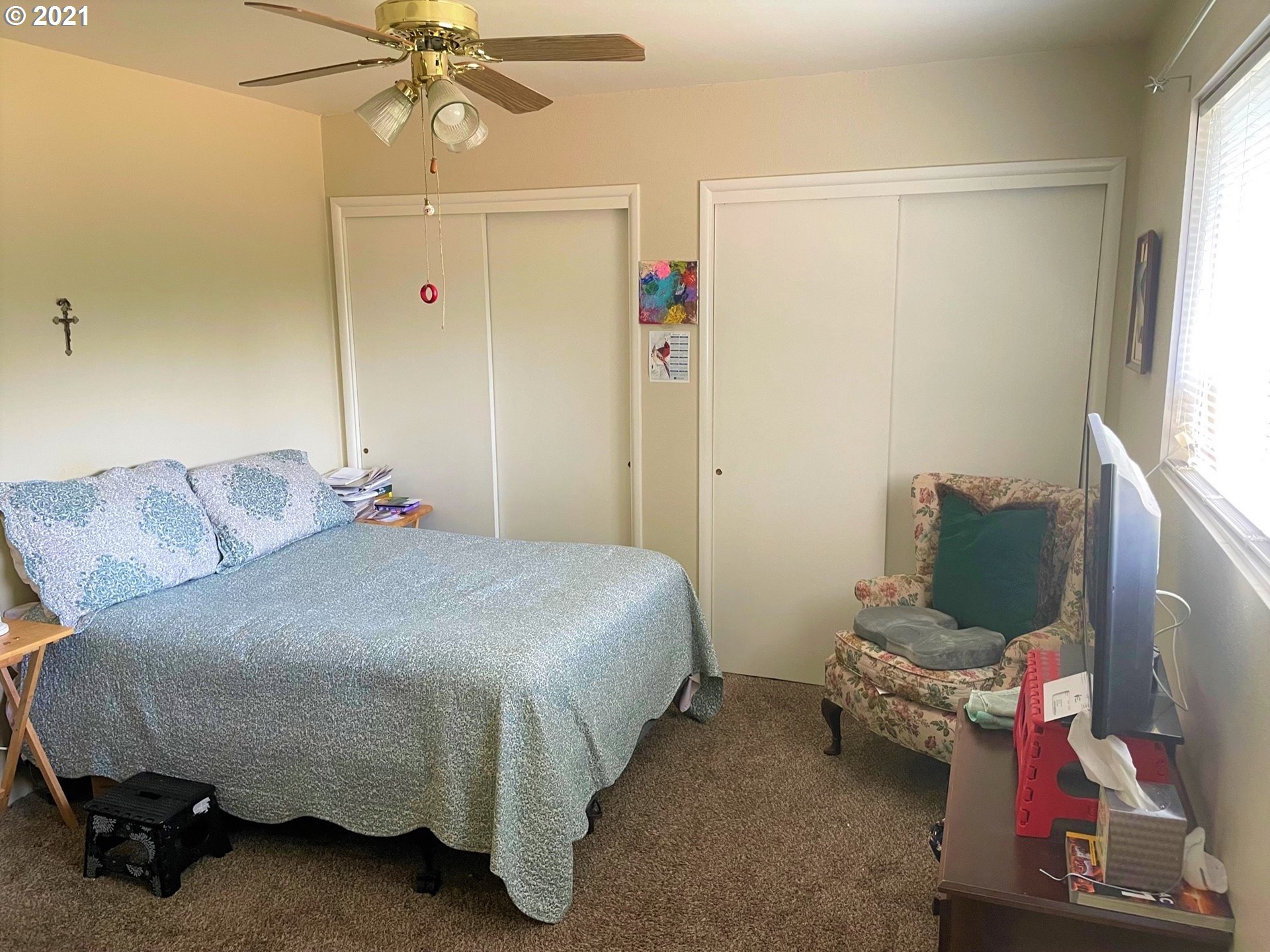 1451 Water Street Springfield, OR 97477 - Photo 13 of 23 a bedroom with a bed and window