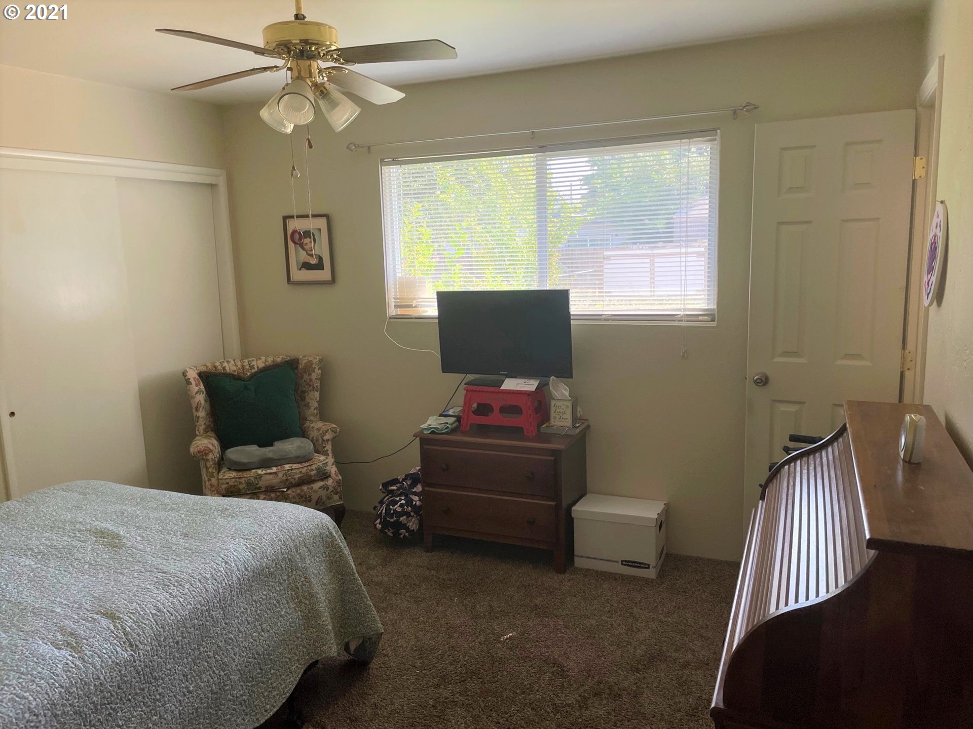 1451 Water Street Springfield, OR 97477 - Photo 14 of 23 a bedroom with a bed and a window