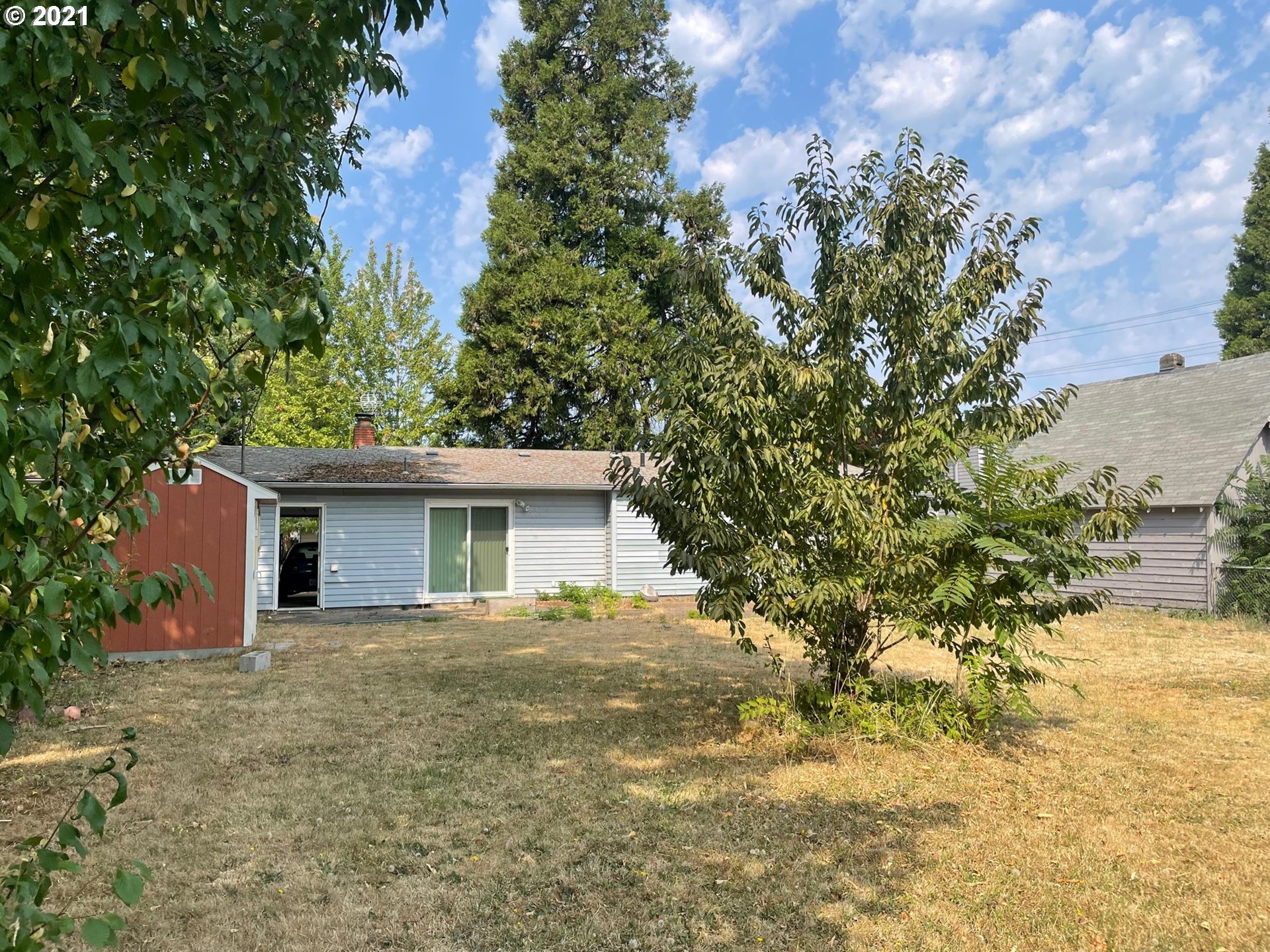 1451 Water Street Springfield, OR 97477 - Photo 19 of 23 a house with trees in the background