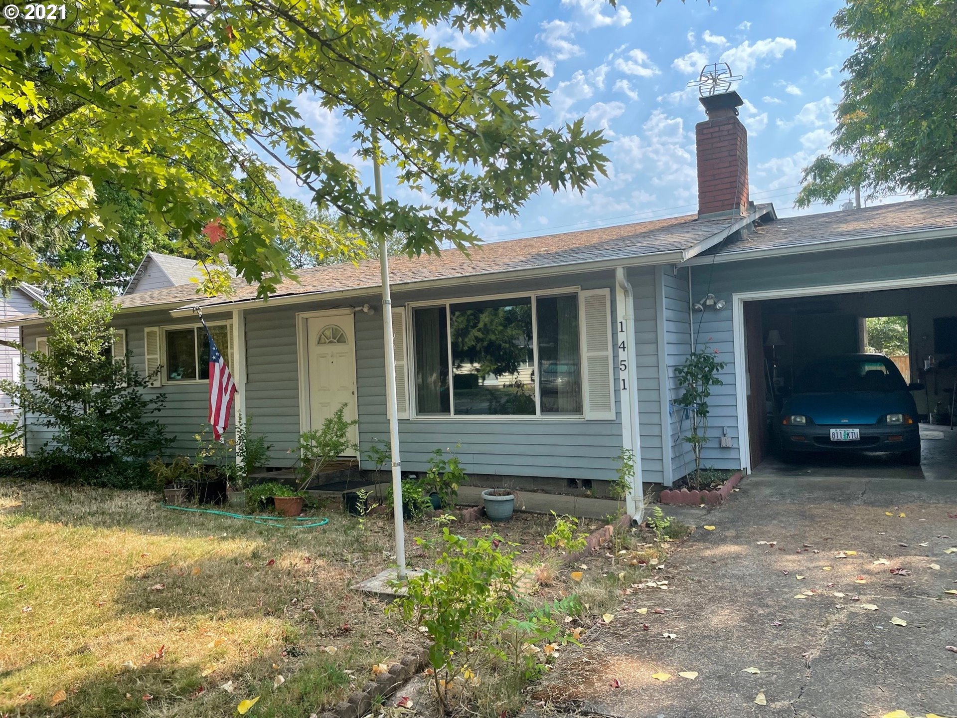 1451 Water Street Springfield, OR 97477 - Photo 3 of 23 a front view of a house with garden