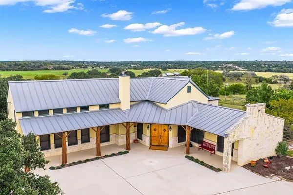 an outdoor sitting area with a table and chair