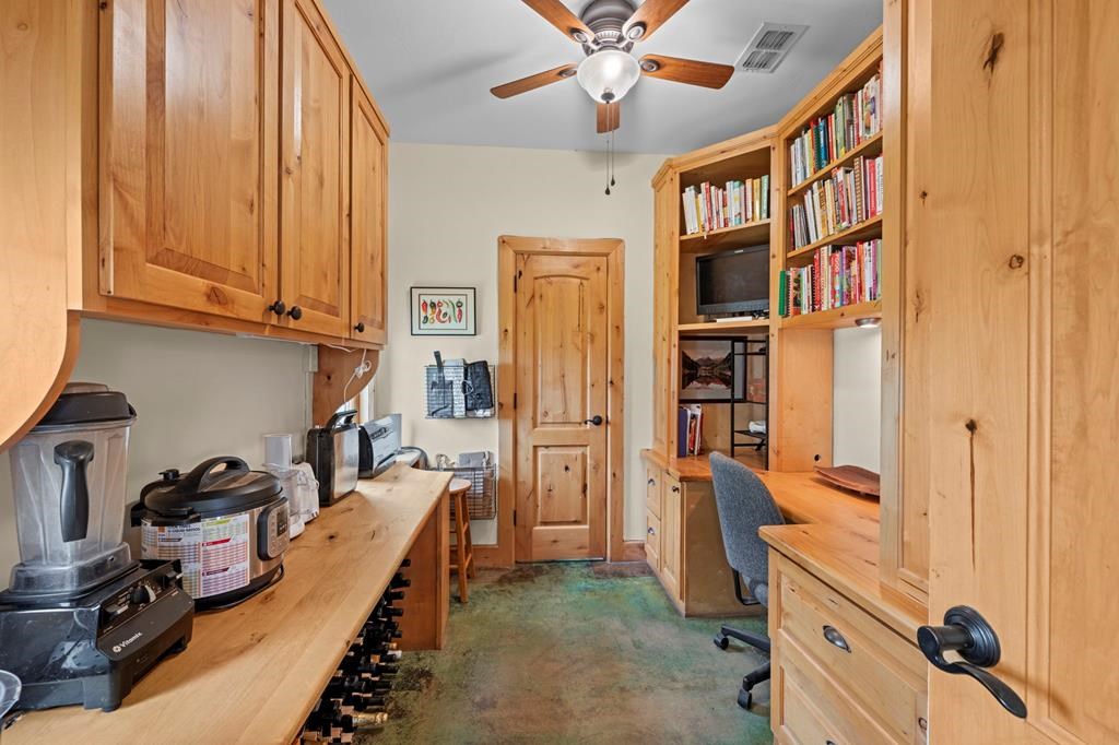 2320 Fiedler Road Harper, TX 78631 - Photo 20 of 78 a kitchen with stainless steel appliances granite countertop a refrigerator and a stove top oven