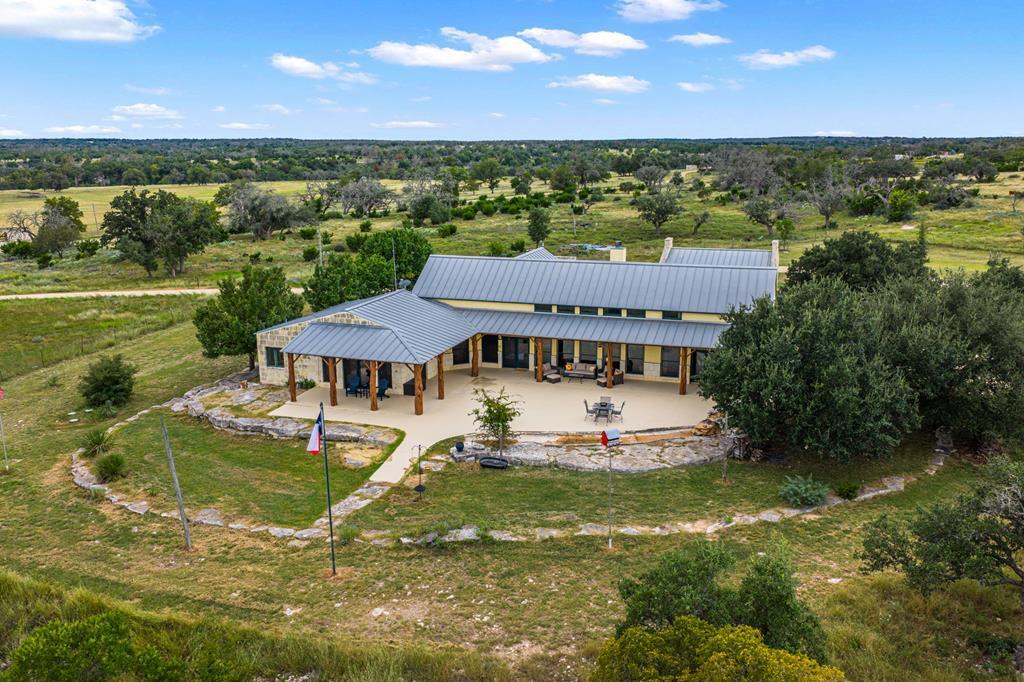 2320 Fiedler Road Harper, TX 78631 - Photo 31 of 78 a view of a big house with a big yard