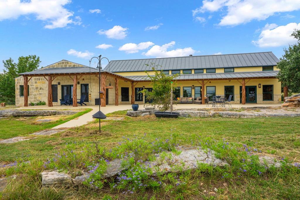 2320 Fiedler Road Harper, TX 78631 - Photo 38 of 78 a swimming pool view with a seating space and a garden view