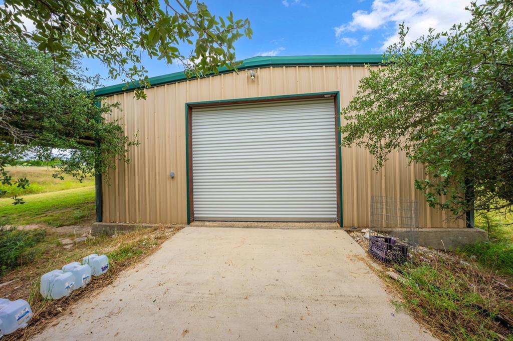 2320 Fiedler Road Harper, TX 78631 - Photo 43 of 78 a view of a small house with wooden fence