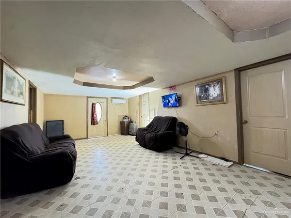 a bedroom with a bed and a couch