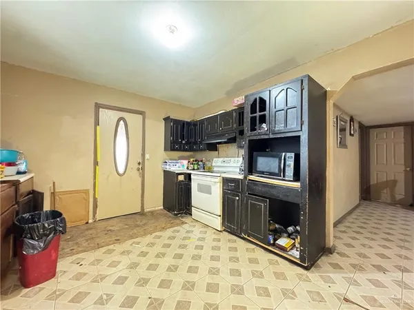 a kitchen with stainless steel appliances granite countertop a stove and a sink