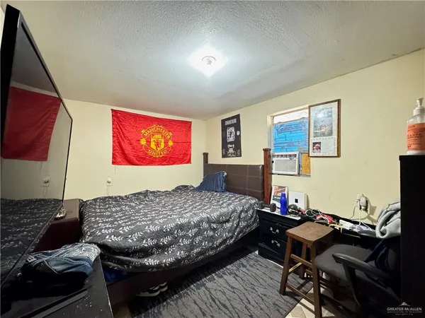 a bedroom with a bed and furniture