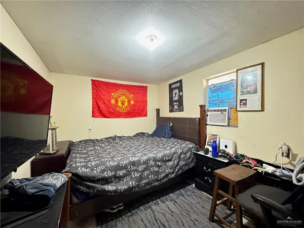 a bedroom with a bed and furniture