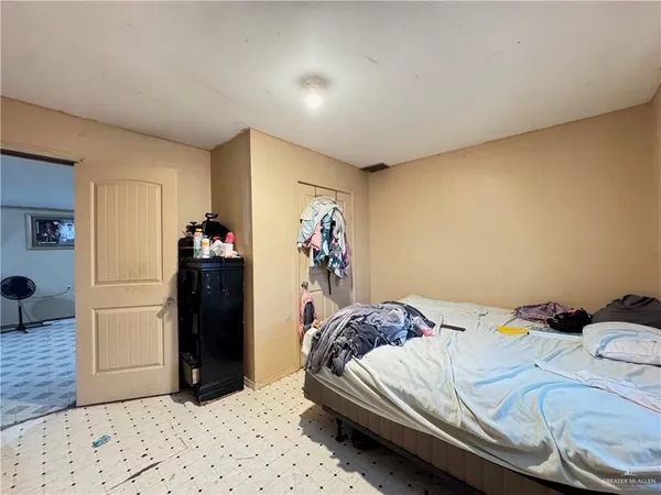 a bedroom with a bed and a cabinets