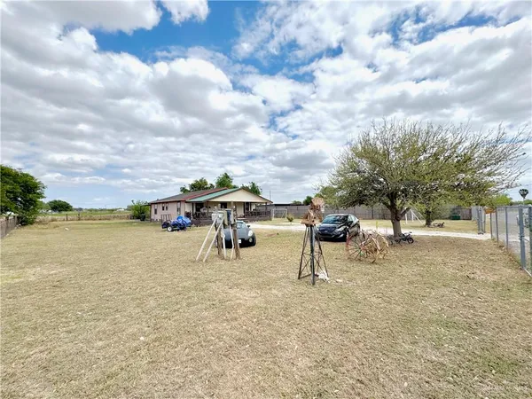 a view of a lake with a table and chairs