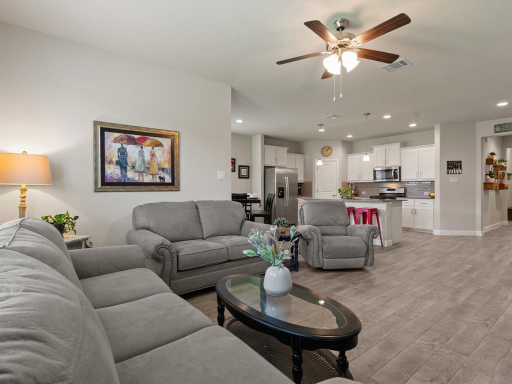 270 Lunayena Road Rhome, TX 76078 - Photo 24 of 37 The backyard offers a spacious outdoor setting with a covered patio, creating an ideal space for outdoor dining, relaxing, or entertaining while enjoying the open Texas landscape.