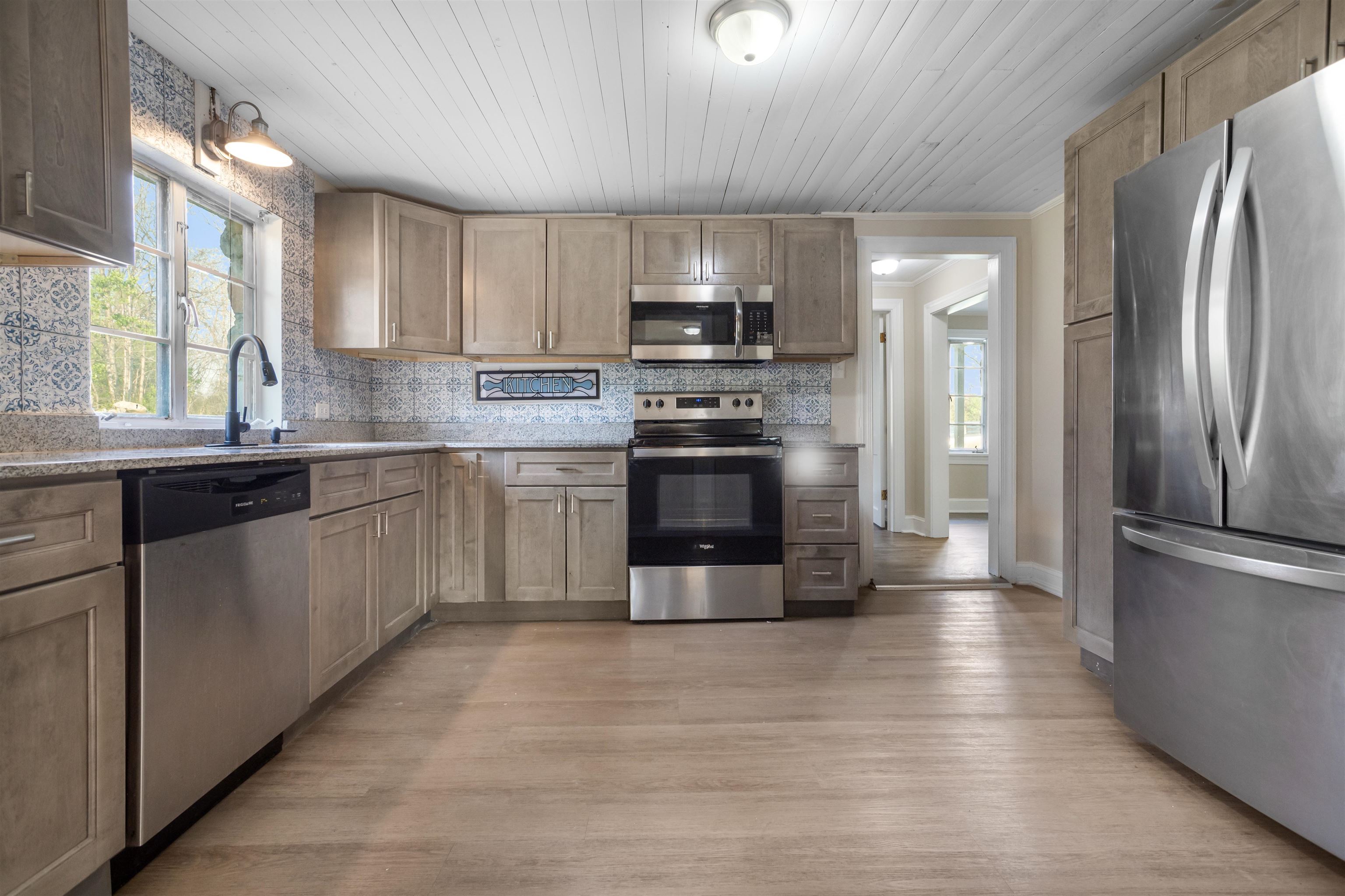 1641 Smithland Road Harrisonburg, VA 22802 - Photo 13 of 44 a kitchen with stainless steel appliances granite countertop a refrigerator a sink a stove a microwave and wooden cabinets