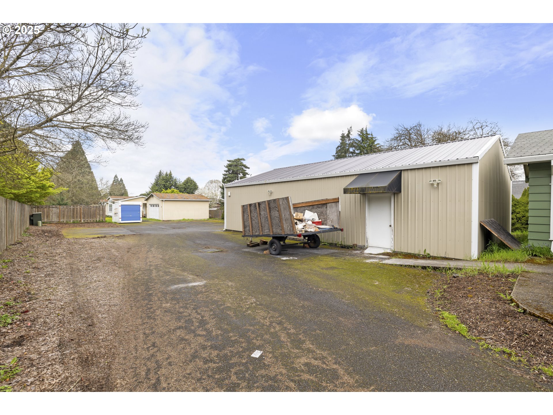 4015 Southwest 185th Avenue Beaverton, OR 97078 - Photo 18 of 47 a view of a house with backyard and a parking