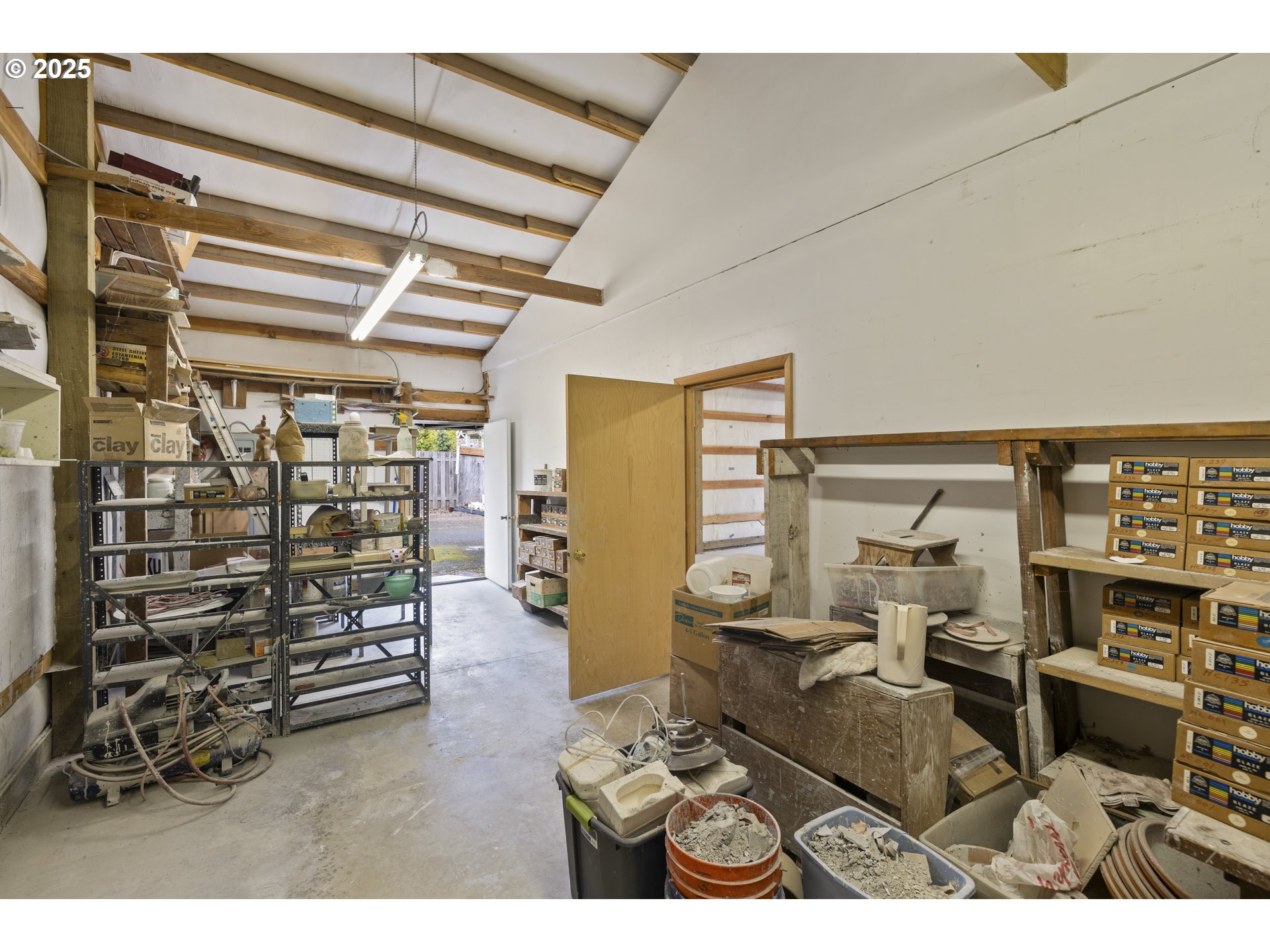 4015 Southwest 185th Avenue Beaverton, OR 97078 - Photo 21 of 47 a living room with furniture and a book shelf
