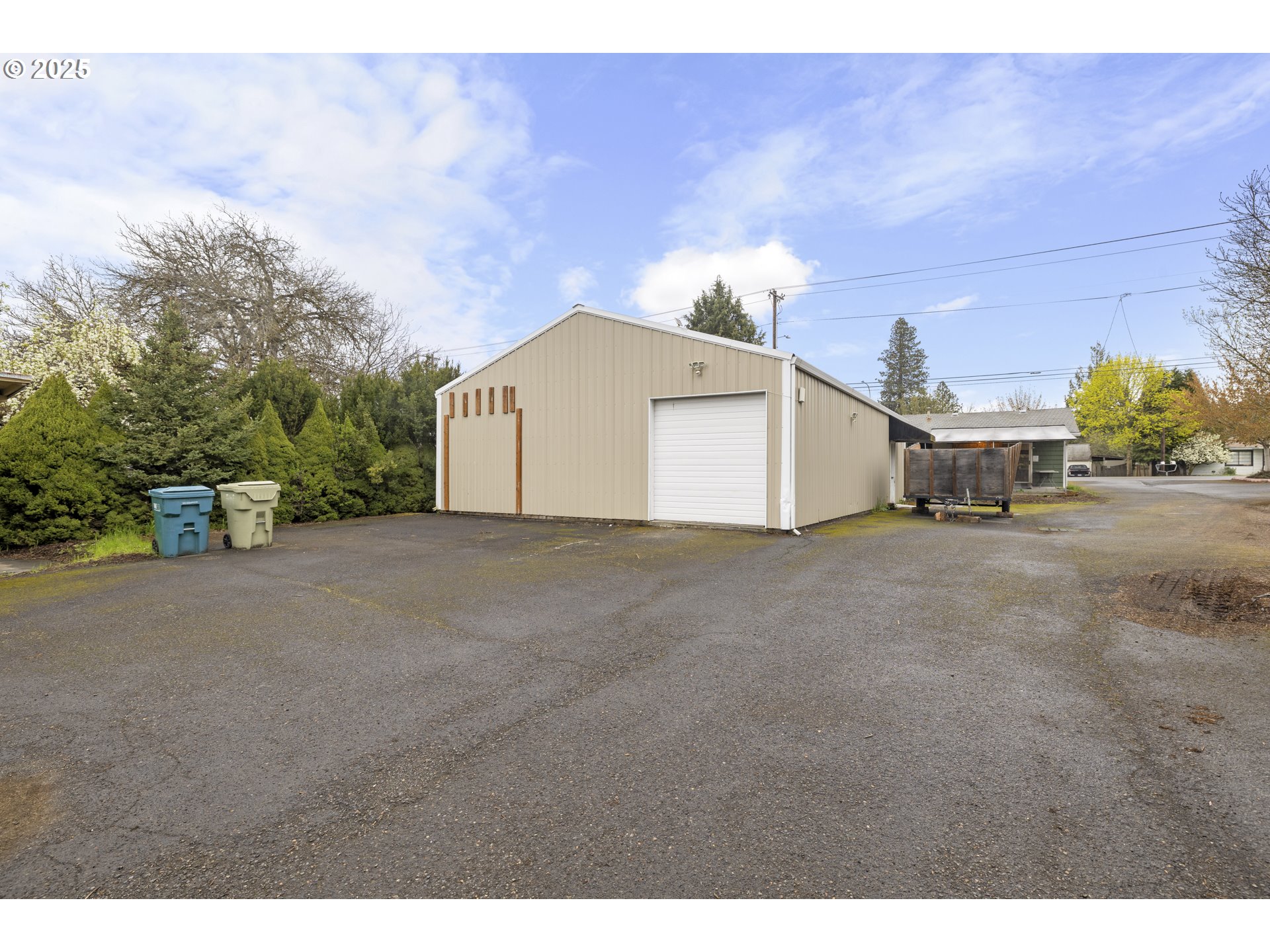 4015 Southwest 185th Avenue Beaverton, OR 97078 - Photo 22 of 47 a view of a house with a yard and garage