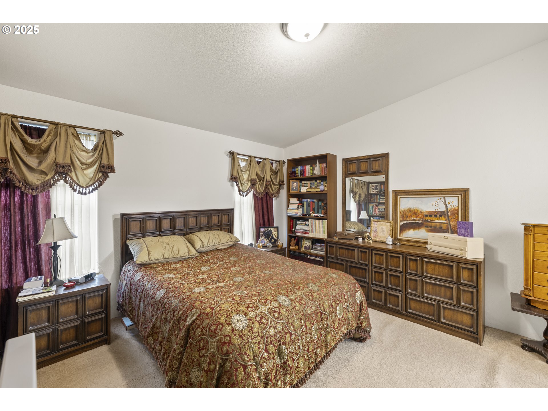 4015 Southwest 185th Avenue Beaverton, OR 97078 - Photo 35 of 47 a bedroom with a bed a dresser and next to a window