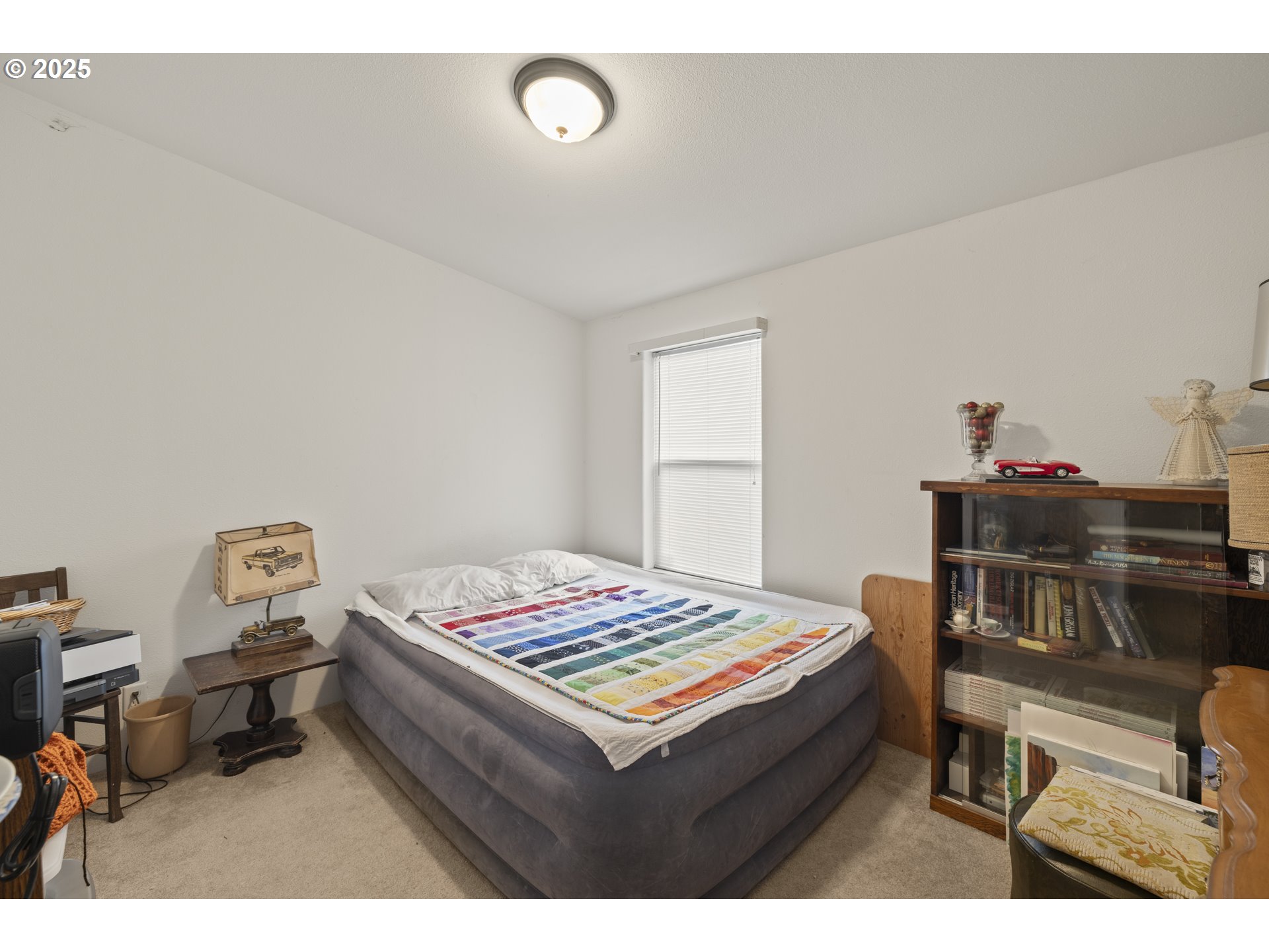 4015 Southwest 185th Avenue Beaverton, OR 97078 - Photo 37 of 47 a living room with a baby bed furniture and next to a window