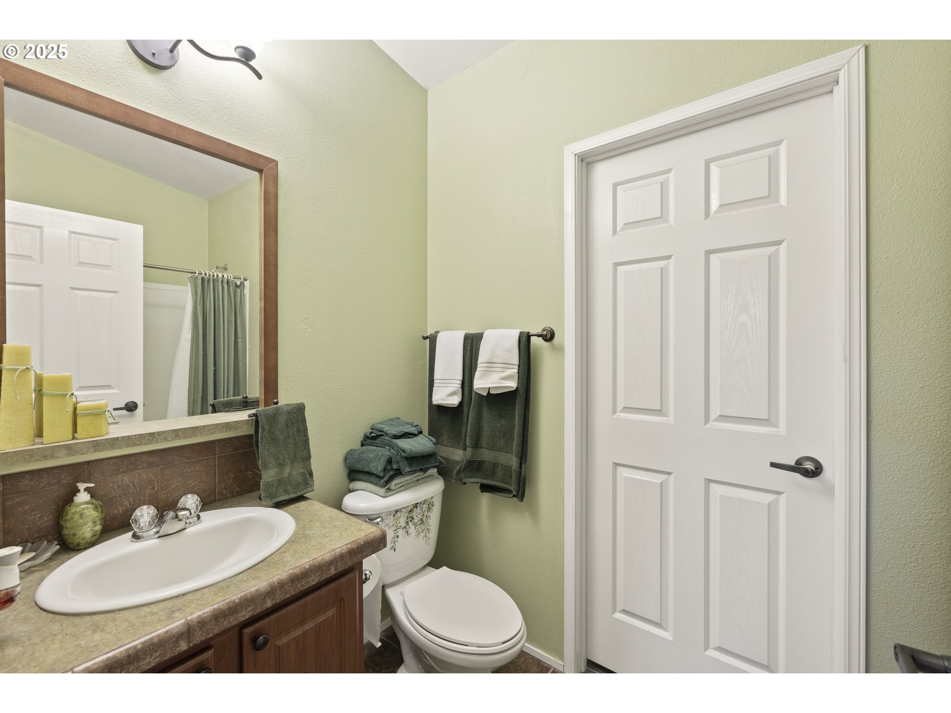 4015 Southwest 185th Avenue Beaverton, OR 97078 - Photo 38 of 47 a bathroom with a toilet a sink and mirror