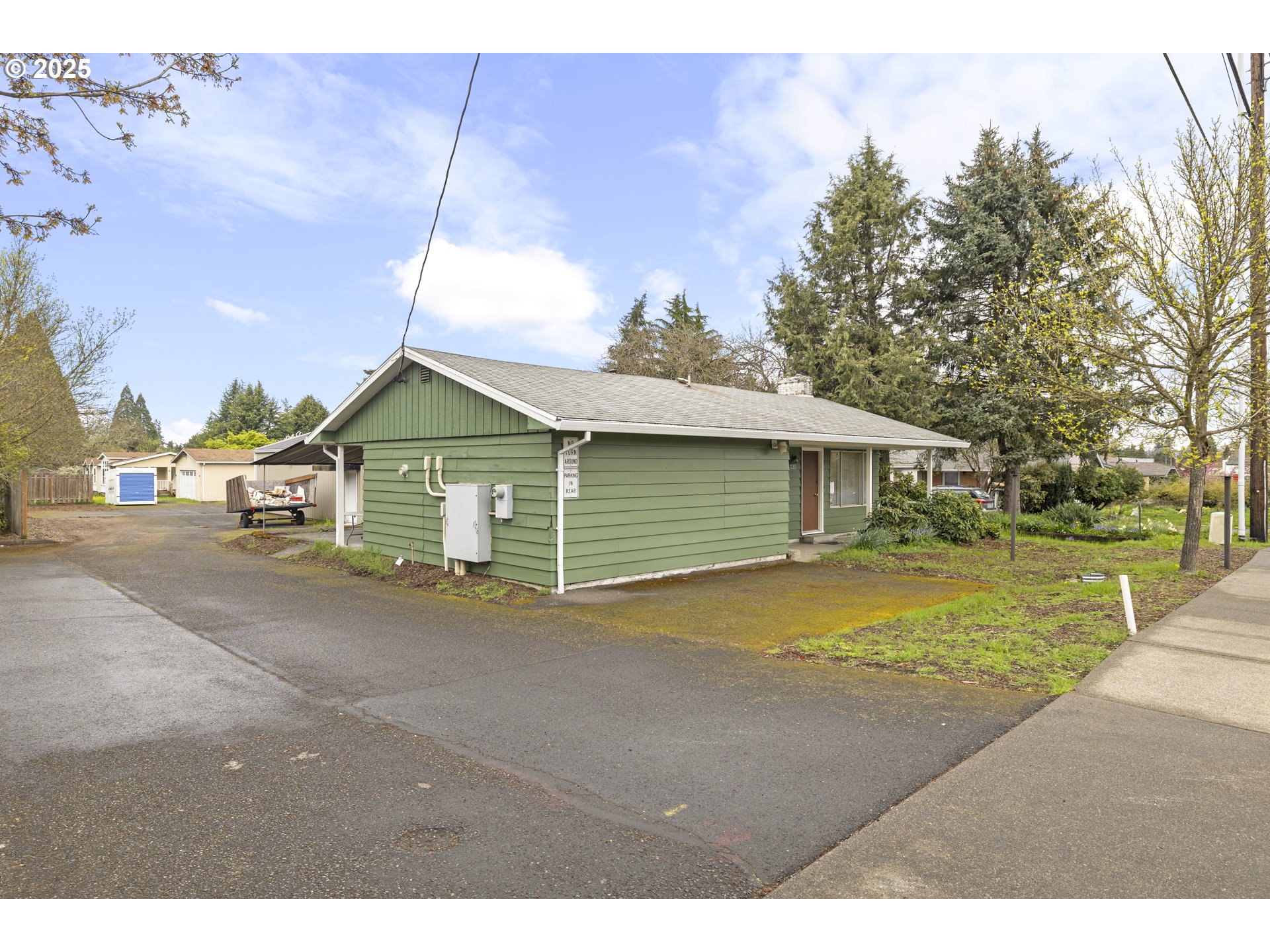 4015 Southwest 185th Avenue Beaverton, OR 97078 - Photo 5 of 47 a front view of a house with a yard and garage