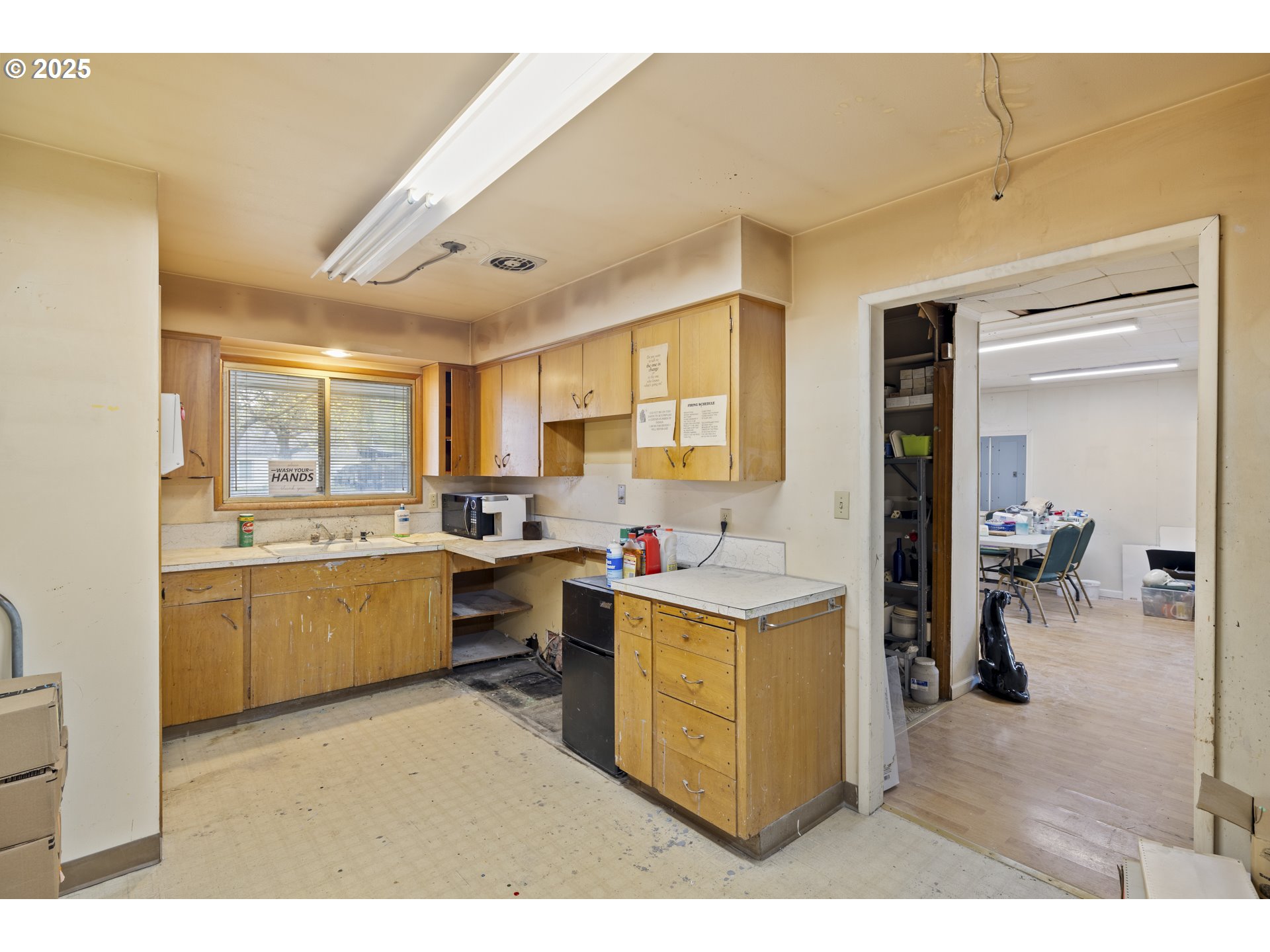 4015 Southwest 185th Avenue Beaverton, OR 97078 - Photo 8 of 47 a kitchen that has a lot of cabinets in it and wooden floors