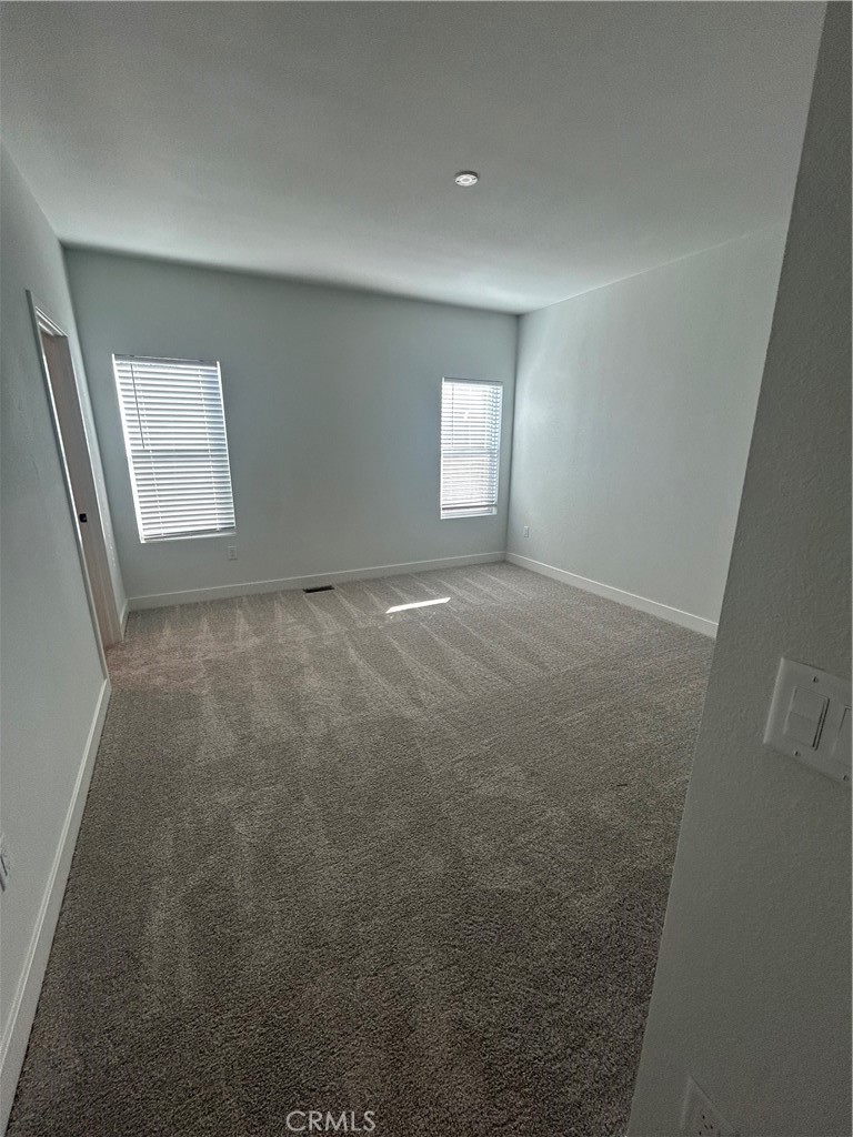 15601 South B Street, Unit 12 Tustin, CA 92780 - Photo 15 of 22 en empty room with windows
