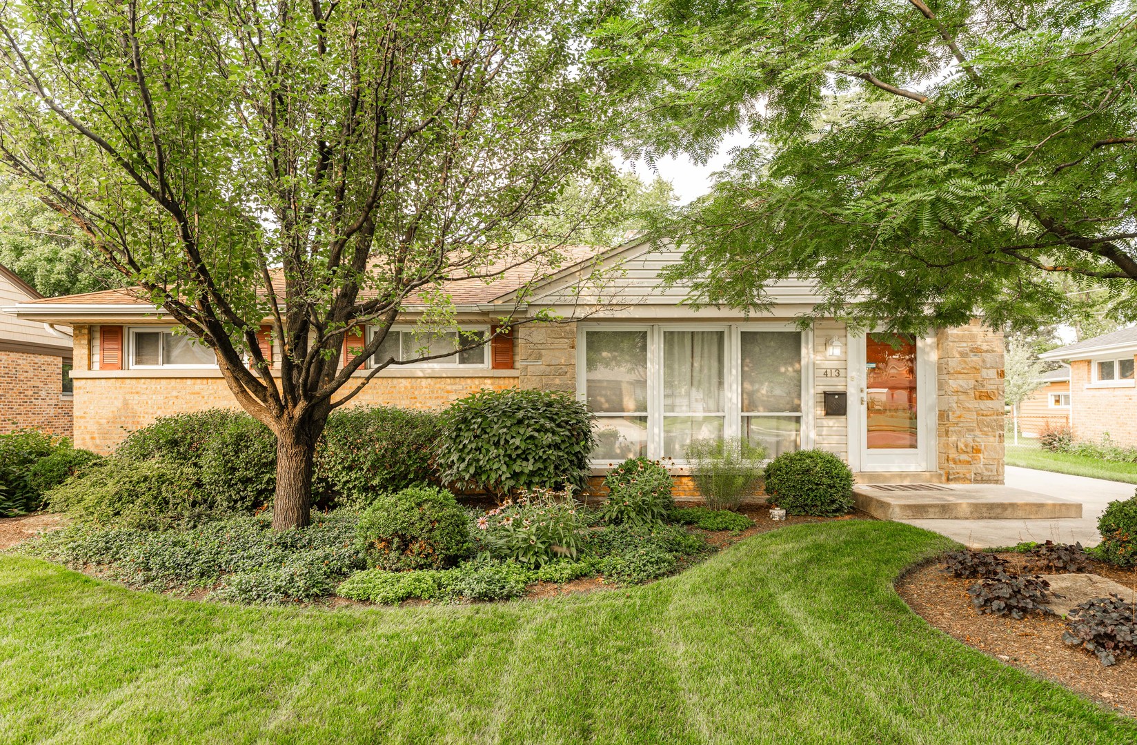 413 Oak Street Elmhurst, IL 60126 - Photo 1 of 38 a front view of a house with a yard