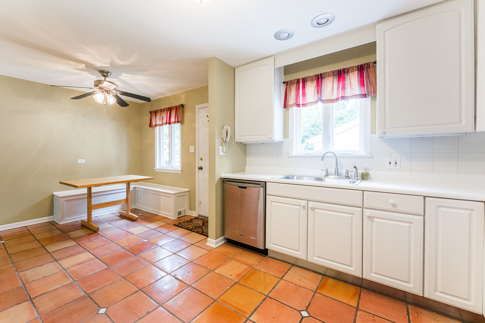 413 Oak Street Elmhurst, IL 60126 - Photo 11 of 38 a kitchen with a sink cabinets and window