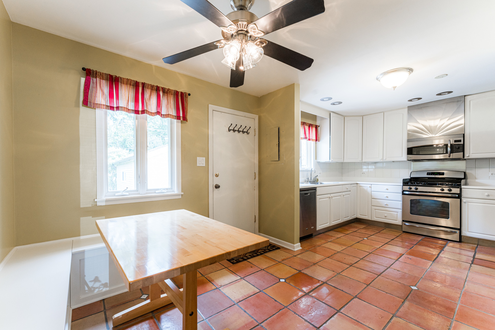 413 Oak Street Elmhurst, IL 60126 - Photo 13 of 38 a kitchen with stainless steel appliances granite countertop a refrigerator and a stove top oven