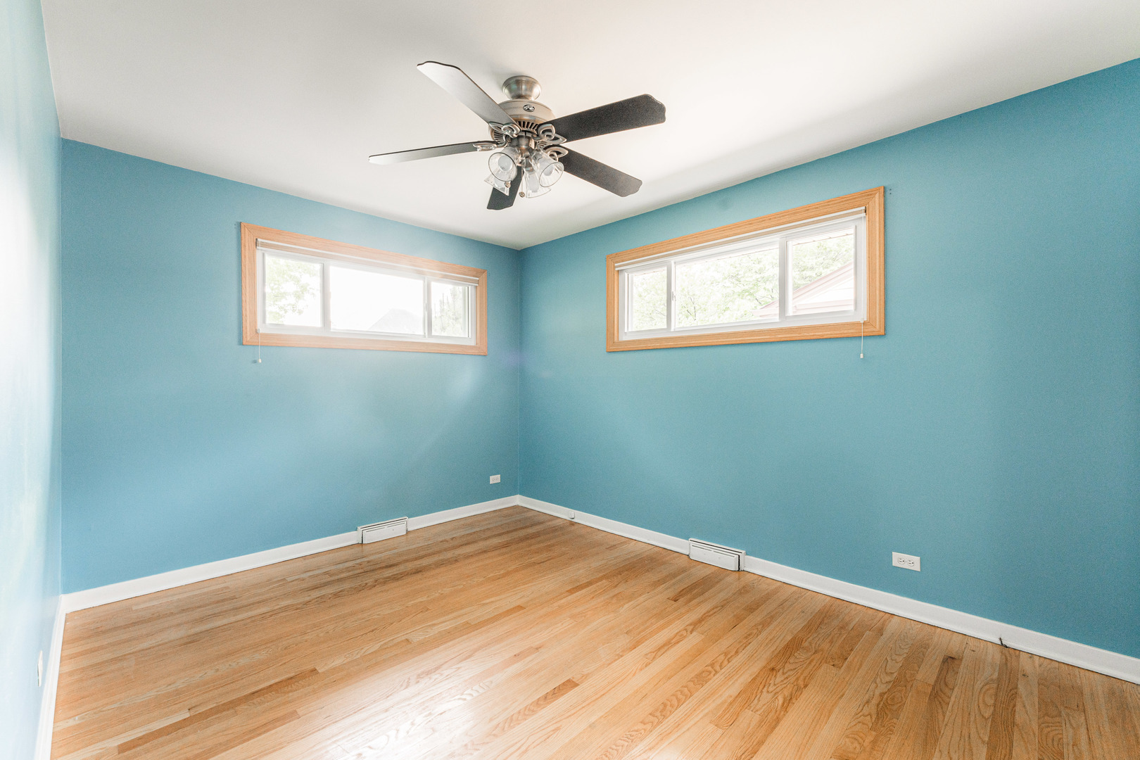 413 Oak Street Elmhurst, IL 60126 - Photo 17 of 38 a view of a big room with wooden floor and windows