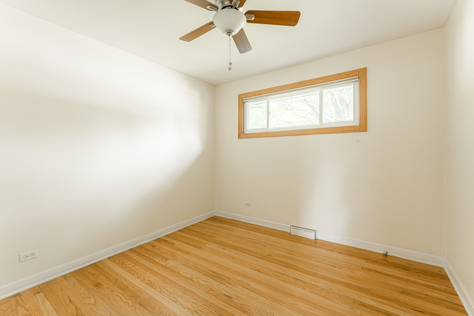 413 Oak Street Elmhurst, IL 60126 - Photo 18 of 38 a view of empty room with wooden floor and fan