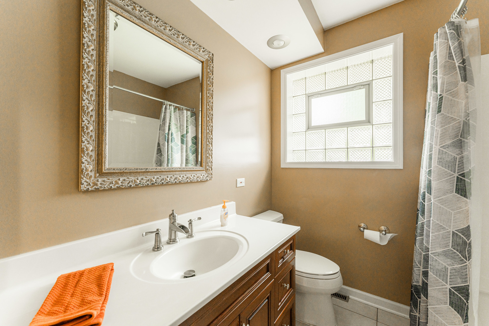 413 Oak Street Elmhurst, IL 60126 - Photo 19 of 38 a bathroom with a sink and a mirror