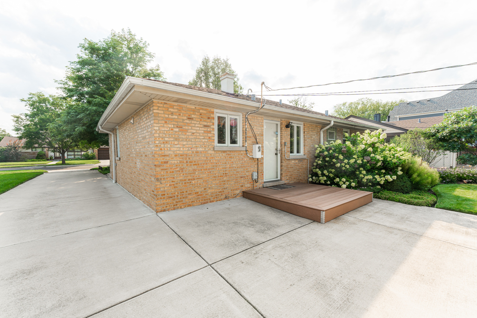 413 Oak Street Elmhurst, IL 60126 - Photo 22 of 38 a view of a house with a yard and potted plants