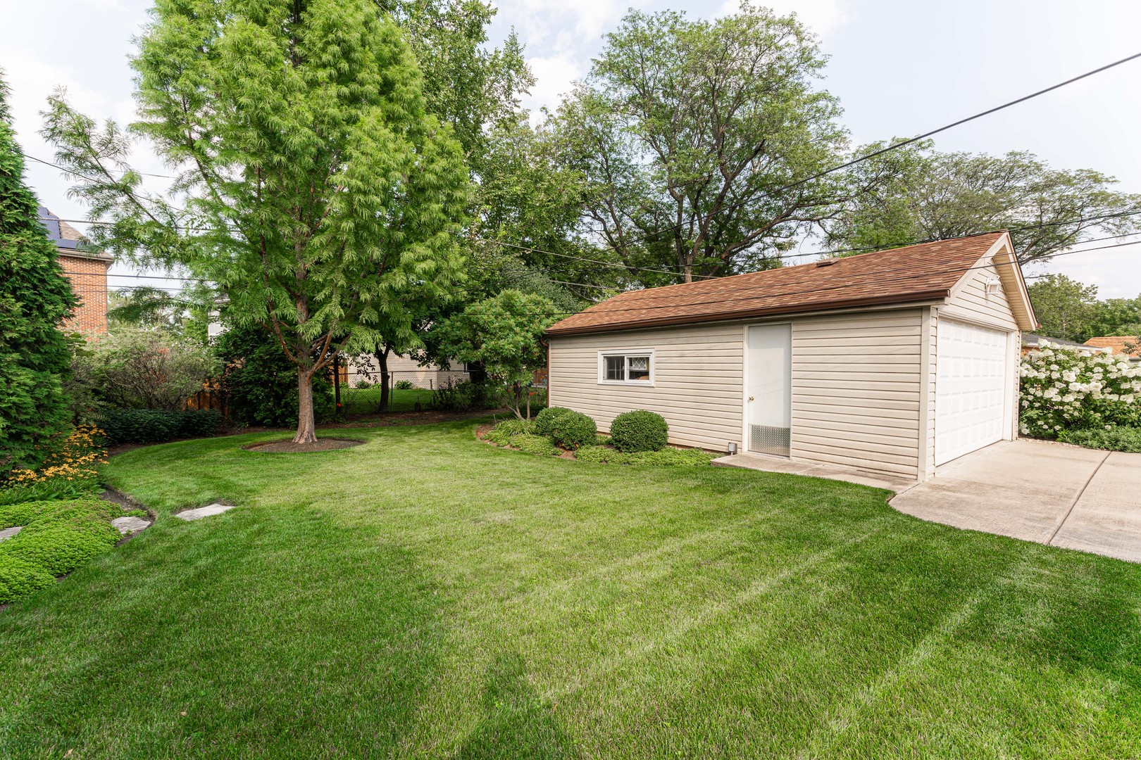 413 Oak Street Elmhurst, IL 60126 - Photo 24 of 38 a view of a backyard with a garden