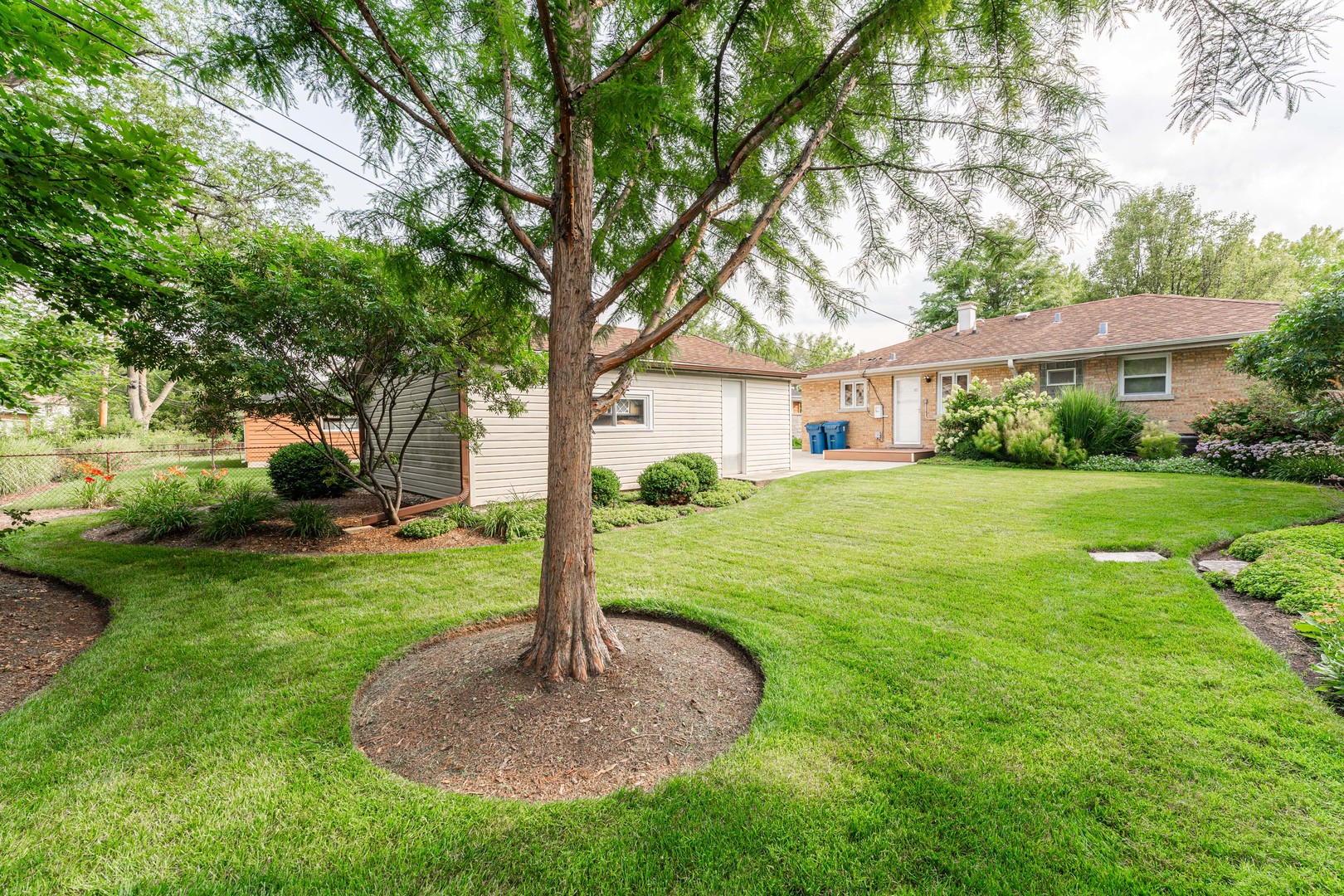 413 Oak Street Elmhurst, IL 60126 - Photo 25 of 38 a front view of a house with garden