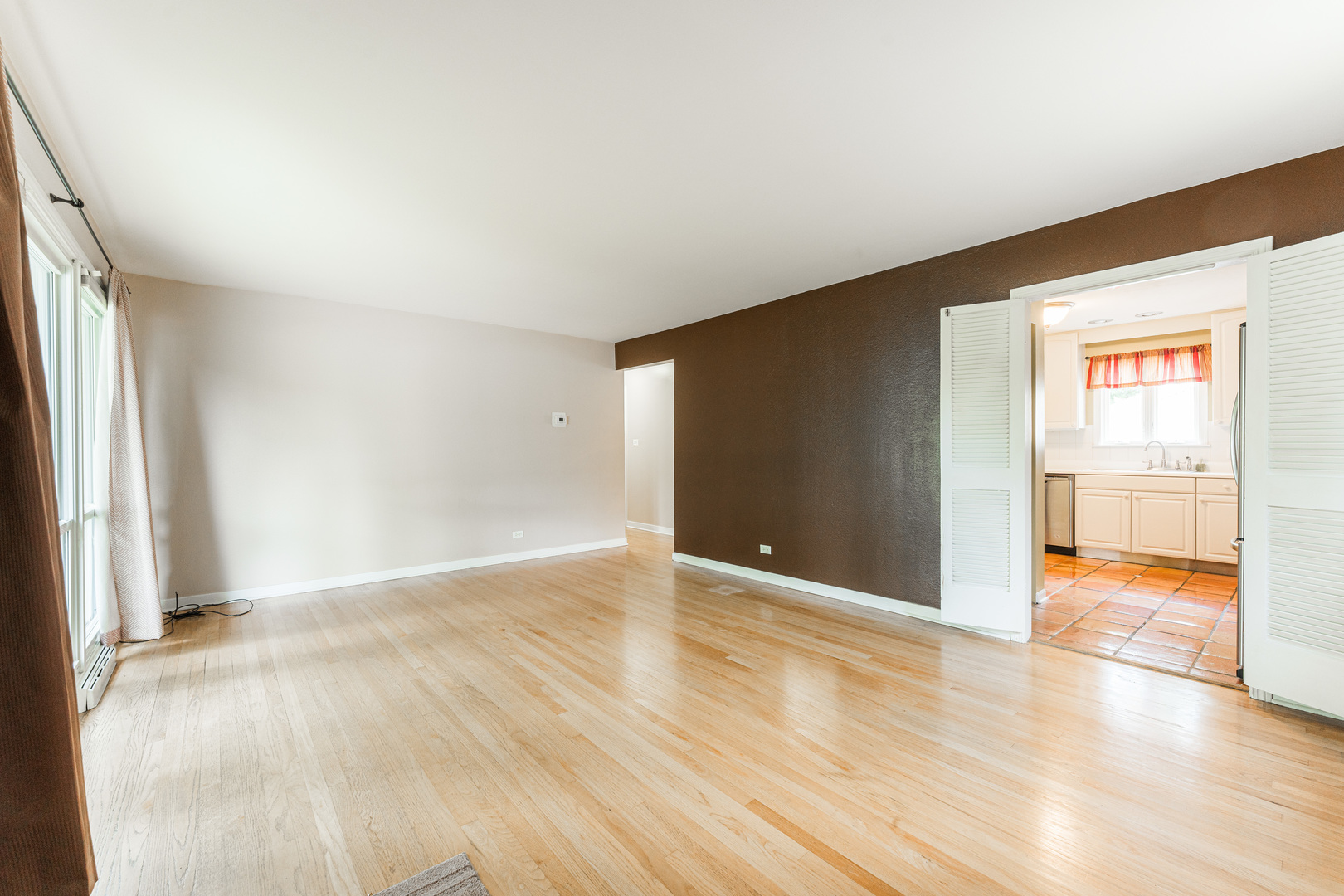 413 Oak Street Elmhurst, IL 60126 - Photo 7 of 38 an empty room with wooden floor and windows