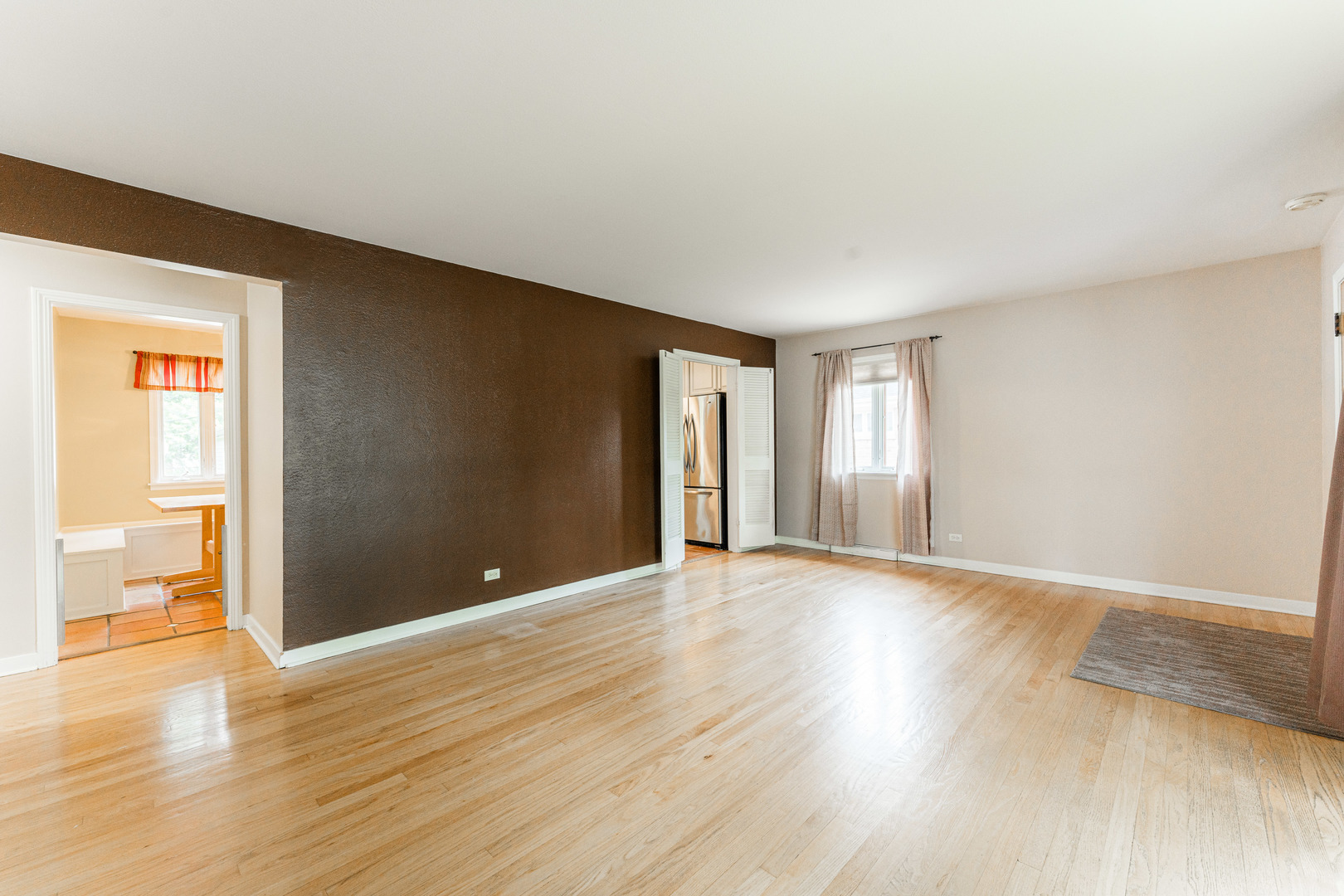 413 Oak Street Elmhurst, IL 60126 - Photo 9 of 38 a view of an empty room with wooden floor