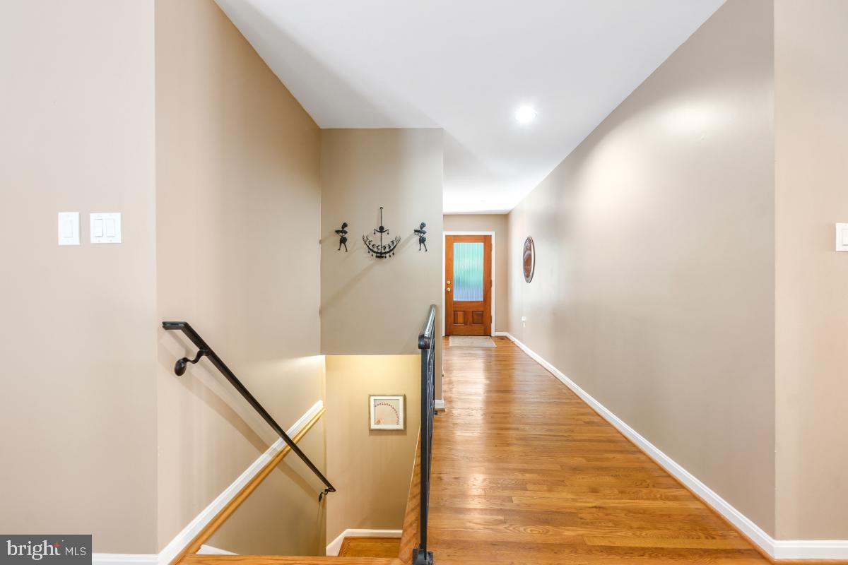 10411 Adel Road Oakton, VA 22124 - Photo 18 of 27 Stairs from the living room lead to lower level.