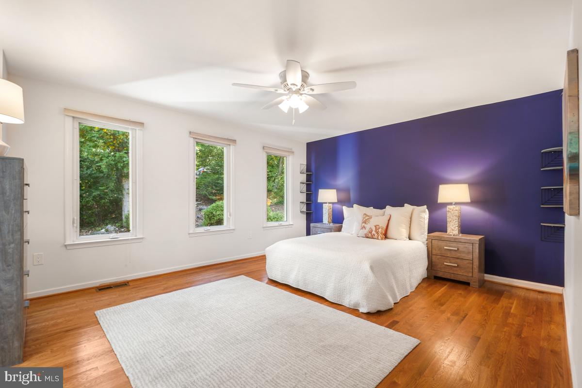 10411 Adel Road Oakton, VA 22124 - Photo 10 of 27 Primary bedroom has three large windows.