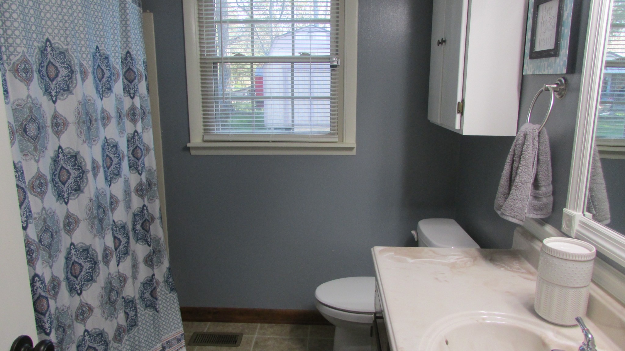 3455 Gimlet Road Lawrenceburg, TN 38464 - Photo 19 of 28 a white toilet sitting next to a shower curtain