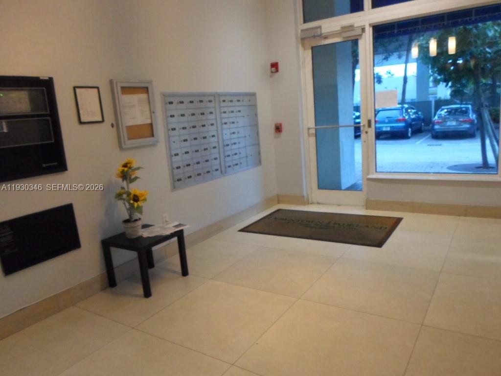 7275 Southwest 90th Way, Unit G 611 Miami, FL 33156 - Photo 55 of 56 a living room with furniture and a fireplace