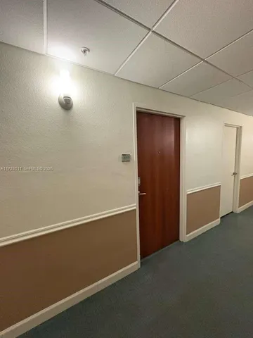 a view of balcony with wooden floor