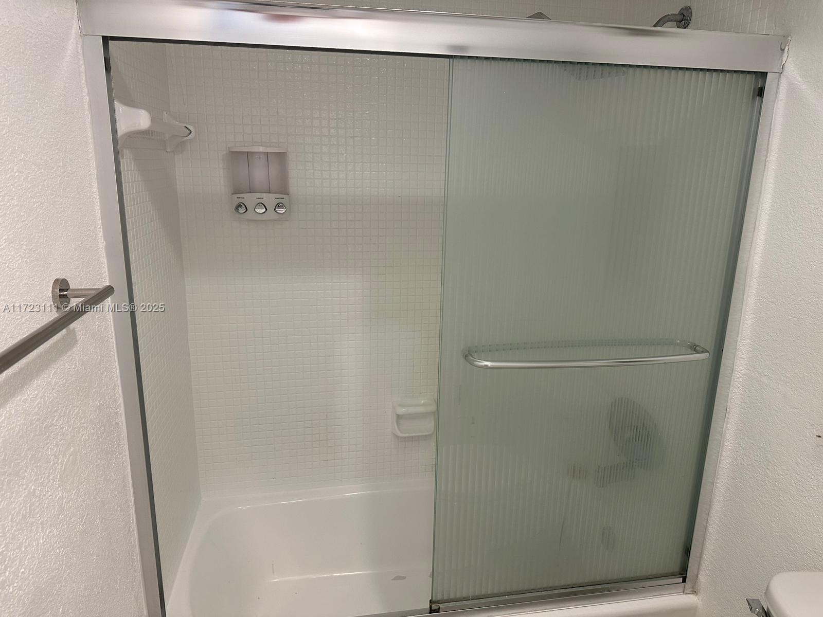 4001 South Ocean Drive, Unit 10D Hollywood, FL 33019 - Photo 15 of 28 a bathroom with a glass shower door