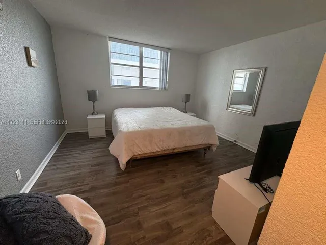 a bathroom with a sink a mirror and a shower