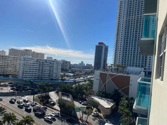 a swimming pool with outdoor seating and yard