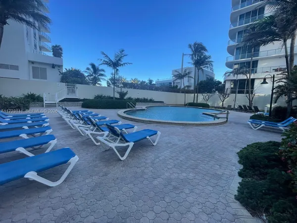 an aerial view of a house with outdoor space and lake view