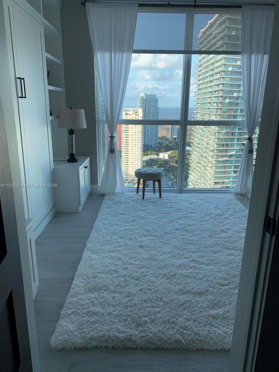 1080 Brickell Avenue, Unit 4101 Miami, FL 33131 - Photo 10 of 11 a view of an empty room with a window