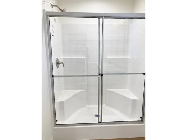 a view of a porch with a floor to ceiling window