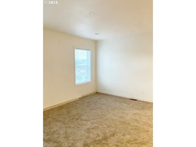 a en suite bathroom with a sink double vanity and a mirror
